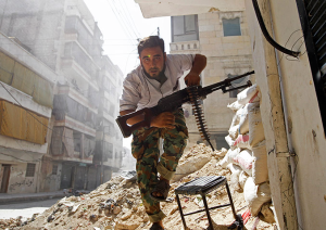 war-in-syria-man-with-automatic-riffle-photo-by-goran-tomase